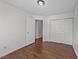 A spacious bedroom featuring a closet and wood-look floors that complement the clean white walls at 224 Hartshorn Ct, Holly Springs, NC 27540