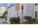 Front porch with white railings and landscaping at 224 Hartshorn Ct, Holly Springs, NC 27540