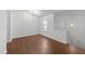 This open living room boasts attractive floors, a neutral color palette, and natural light at 224 Hartshorn Ct, Holly Springs, NC 27540