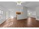 Spacious living room with wood floors and access to the kitchen and backyard at 224 Hartshorn Ct, Holly Springs, NC 27540