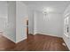 Bright living room featuring dark wood floors, and a neutral color palette with ample natural light at 224 Hartshorn Ct, Holly Springs, NC 27540