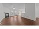 Open floorplan living room with fireplace and lots of windows for natural light at 224 Hartshorn Ct, Holly Springs, NC 27540