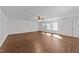 Spacious living room with a ceiling fan, and multiple windows providing tons of natural light at 224 Hartshorn Ct, Holly Springs, NC 27540