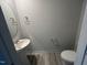 Simple half bathroom with pedestal sink and modern fixtures at 260 Johnson Ridge Way, Four Oaks, NC 27524