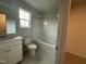 Bathroom featuring a vanity, combination tub and shower at 260 Johnson Ridge Way, Four Oaks, NC 27524