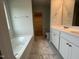 Bathroom featuring double vanity, soaking tub and walk-in closet at 260 Johnson Ridge Way, Four Oaks, NC 27524