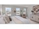Inviting bedroom with soft carpet, three bright windows, and decorative wall art at 260 Johnson Ridge Way, Four Oaks, NC 27524