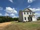 Inviting two-story home with vinyl siding, attached garage, surrounded by a lush green lawn at 260 Johnson Ridge Way, Four Oaks, NC 27524