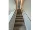 Carpeted staircase with handrail at 260 Johnson Ridge Way, Four Oaks, NC 27524