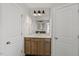 Bathroom vanity with modern sink, fixtures, and cabinetry with hardware at 267 N Maple Walk Dr # 217, Garner, NC 27529