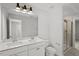 Bright bathroom with double vanity, and a modern glass-enclosed shower at 267 N Maple Walk Dr # 217, Garner, NC 27529