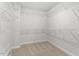Walk-in closet with carpet floor, white paint and full of wire shelves at 267 N Maple Walk Dr # 217, Garner, NC 27529