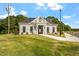 Elegant community center with beautiful landscaping and welcoming entrance at 267 N Maple Walk Dr # 217, Garner, NC 27529