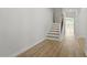 Bright entryway features wood flooring and stairs leading to the upper level at 267 N Maple Walk Dr # 217, Garner, NC 27529