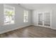 Versatile space with neutral walls, wood floors, and ample natural light from large windows at 267 N Maple Walk Dr # 217, Garner, NC 27529