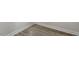 Close up view of attractive base molding and luxury vinyl plank flooring at 267 N Maple Walk Dr # 217, Garner, NC 27529