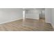 Open living room with wood floors and a welcoming, spacious layout at 267 N Maple Walk Dr # 217, Garner, NC 27529