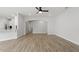 Open living room with hardwood floors, recessed lighting, and a view into adjoining rooms at 267 N Maple Walk Dr # 217, Garner, NC 27529