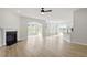 Open-concept living space features a fireplace, archway, windows, and eat in kitchen with island at 267 N Maple Walk Dr # 217, Garner, NC 27529