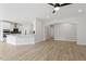 Bright, open-concept living space with hardwood floors seamlessly connecting to the kitchen area at 267 N Maple Walk Dr # 217, Garner, NC 27529