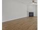 A spacious living room with light colored floors and fireplace at 267 N Maple Walk Dr # 217, Garner, NC 27529
