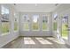 Living room features large windows and door leading to the outside at 267 N Maple Walk Dr # 217, Garner, NC 27529