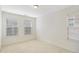 Bright bedroom featuring neutral carpet and several windows with coverings at 2901 Benevolence Dr, Raleigh, NC 27610