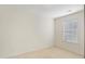 A bright bedroom with neutral carpet and a window at 2901 Benevolence Dr, Raleigh, NC 27610