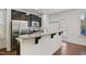 Modern kitchen with stainless steel appliances and a large island with bar seating at 2901 Benevolence Dr, Raleigh, NC 27610