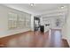Open-concept living room with wood floors and large windows offering plenty of natural light at 2901 Benevolence Dr, Raleigh, NC 27610