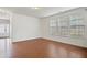 Spacious living room with hardwood floors and multiple windows, perfect for entertaining guests at 2901 Benevolence Dr, Raleigh, NC 27610