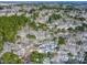 Overhead aerial view of snow covered trees and a neighborhood in the distance at 316 Russ Rd, Smithfield, NC 27577