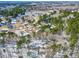 Aerial view of the neighborhood featuring partial snow coverage and green trees at 316 Russ Rd, Smithfield, NC 27577