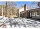 Backyard featuring brick chimney and a patio on a partially snow covered lawn at 316 Russ Rd, Smithfield, NC 27577