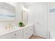 Bright bathroom with dual vanity, framed mirrors, and white cabinetry at 316 Russ Rd, Smithfield, NC 27577