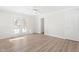 Spacious bedroom featuring wood floors, ceiling fan, and access to the outdoors at 316 Russ Rd, Smithfield, NC 27577