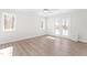 Bright bedroom with wood floors, ceiling fan, and french doors to the outside at 316 Russ Rd, Smithfield, NC 27577