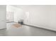 Large bonus room with neutral decor, brick detailing and natural light at 316 Russ Rd, Smithfield, NC 27577