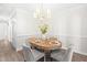 Dining room featuring a wooden table with seating for four under a chandelier light fixture at 316 Russ Rd, Smithfield, NC 27577