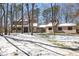 Inviting two-story home nestled in a snow-covered landscape, surrounded by mature trees at 316 Russ Rd, Smithfield, NC 27577