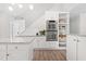 Bright white kitchen featuring modern appliances, a central island and built in ovens at 316 Russ Rd, Smithfield, NC 27577
