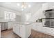 Modern kitchen with stainless steel appliances, island, and bright lighting at 316 Russ Rd, Smithfield, NC 27577