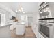 Bright kitchen featuring granite counters, an island, and stainless steel appliances at 316 Russ Rd, Smithfield, NC 27577