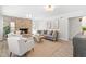 Bright living room featuring a brick fireplace, comfortable seating, and stylish decor at 316 Russ Rd, Smithfield, NC 27577