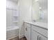 A full bathroom features white cabinets and a tub with a shower at 326 Church St # 42, Wendell, NC 27591