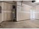 Clean, unfinished garage featuring a water heater and ample space for storage or projects at 326 Church St # 42, Wendell, NC 27591