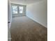 Bright and carpeted bedroom with large windows that provide ample natural light at 328 Church St # 43, Wendell, NC 27591
