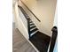 Elegant staircase with dark wood steps and a white wood railing at 328 Church St # 43, Wendell, NC 27591