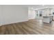 Spacious living room with wood-look floors offering an open floor plan to the kitchen and dining area at 330 Church St # 44, Wendell, NC 27591
