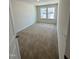 Carpeted bedroom with a double window providing natural light at 332 Church St # 45, Wendell, NC 27591